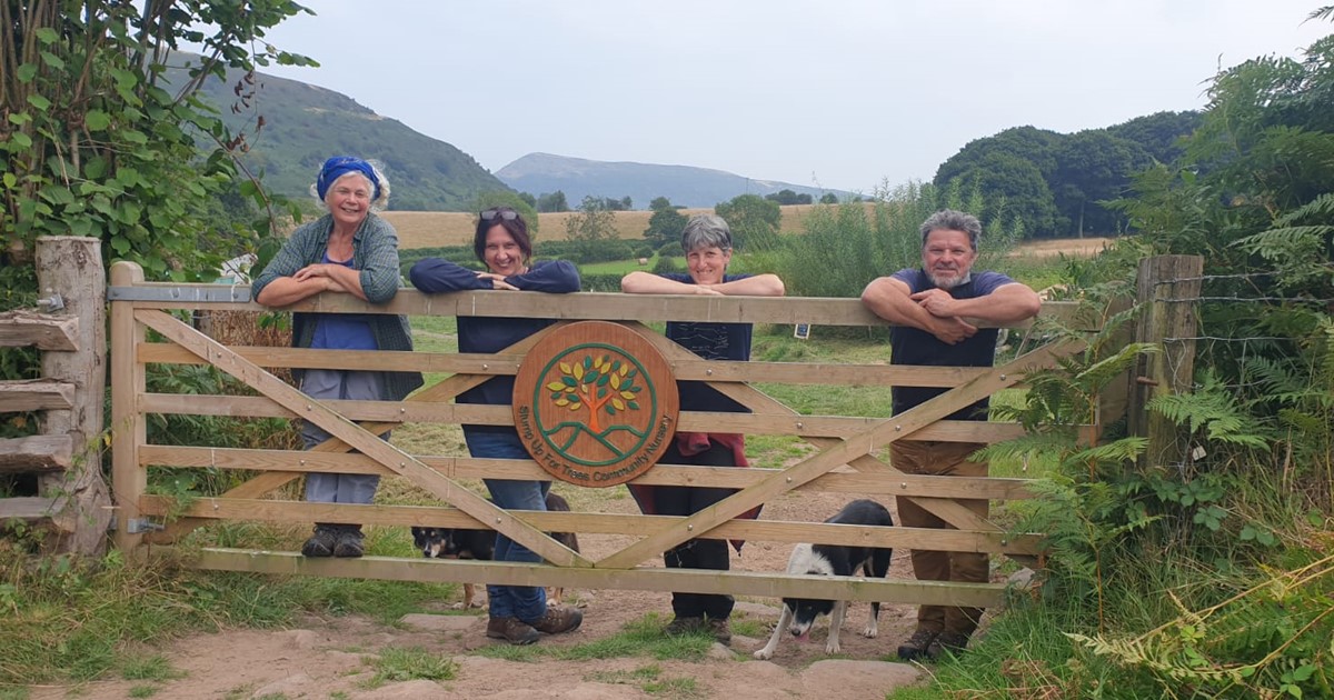 Some of the Stump Up For Trees team leaning on the nursery gate
